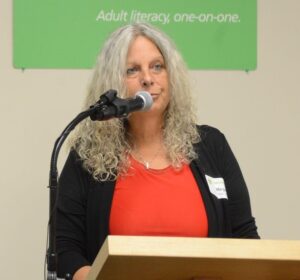 Margaret MacDonald speaking at microphone